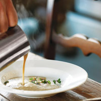 Mushroom soup poured tableside // Photography by Jason Varney