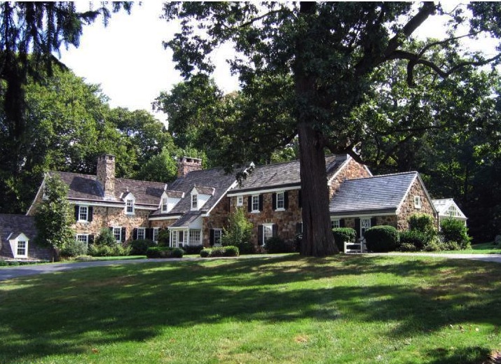 This Okie-designed home for sale is reflective of the famed architects Colonial Revival style.