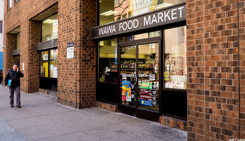 WAWA-with-guy-on-cell-phone-walking-towards-camera