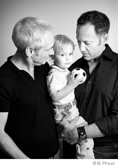 Philly couple Harvey Hurdle and Kevin Yoder pose for a photo with their son. Photo by: Barbara Proud