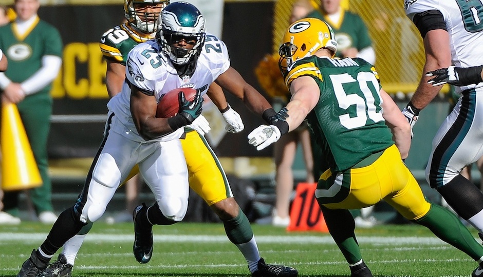 Nov 10, 2013; Green Bay, WI, USA; Philadelphia Eagles running back LeSean McCoy (25) runs with the ball past Green Bay Packers linebacker A.J. Hawk (50) in the first quarter at Lambeau Field. Mandatory Credit: Benny Sieu-USA TODAY Sports