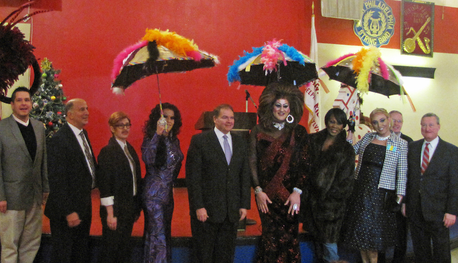 At today's press conference. (L-R) Scott Brown, Director of Tourism for the Fancy Brigade Association; Councilman Mark F. Squilla; Dandy Lion; Crystal Electra; Leo Dignam, Mummers Parade Director; Brittany Lynn; Karen Von Say; Mistress M; Bill Burke, Vice President of the Philadelphia Fancy Brigade Association; and Councilman Jim Kenney were all smiles on Tuesday at the Mummers Museum, where the “Miss Fancy” Brigade announced its plans to march up Broad Street once again as part of the 2014 Mummers Parade.