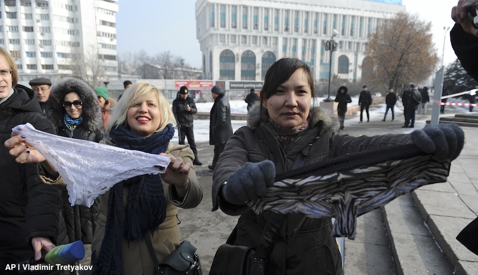 This photo taken on Sunday, Feb. 16, 2014, shows women during a protest against the ban of lace underwear in Almaty, Kazakhstan. A trade ban on synthetic underwear has Russia and her economic allies with their knickers in a twist. Post-Soviet consumers reacted with dismay to news that synthetic underwear will be banned within the Eurasian Economic Commission, which regulates a customs union between Russia, Belarus and Kazakhstan, from July 1. Consumer outcry against the restrictions reached a fever pitch after a Sunday protest in the capital of Kazakhstan, where thirty women wore lace underwear on their heads and shouted “Freedom to panties!” as they were shoved into police vehicles. (AP Photo/Vladimir Tretyakov)