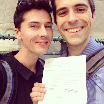 Josh and Alan with their marriage certificate.
