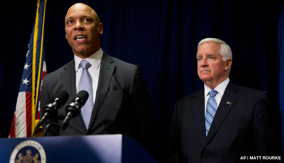 Philadelphia school district Superintendent William Hite, left, accompanied by Gov. Tom Corbett, speaks during a news conference Wednesday, Aug. 6, 2014, in Philadelphia.