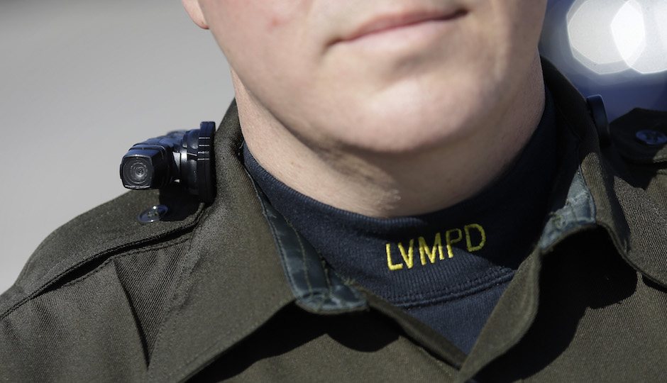 Las Vegas police Sgt. Peter Ferranti models a body camera Wednesday, Nov. 12, 2014, in Las Vegas. The camera is the same type now being used by about 200 street officers in Las Vegas. Philly has started testing body cameras. (AP Photo/John Locher)