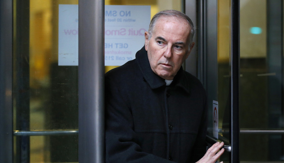 The Rev. Charles Engelhardt walks from the Criminal Justice Center, Monday, Jan. 14, 2013, in Philadelphia. Engelhardt was charged with sexual assaulting an altar boy in northeast Philadelphia in the late 1990s. (AP Photo/Matt Rourke)