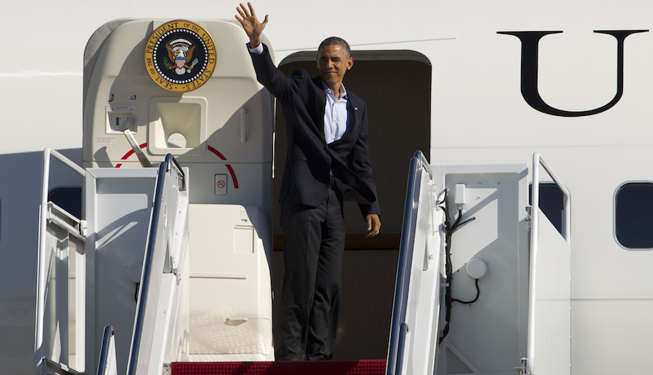 President Barack Obama waves from Air Force One, before departure at Andrews Air Force Base, Md., on Sunday, Nov. 2, 2014. Obama is traveling to Bridgeport, Conn., and later to Philadelphia, Pa., for a campaign events for gubernatorial democratic candidates in both states. (AP Photo/Jose Luis Magana)