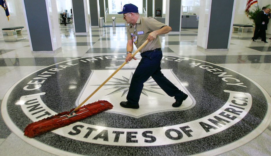 In this March 3, 2005 file photo, a workman slides a dustmop over the floor at the Central Intelligence Agency headquarters in Langley, Va. Senate investigators have delivered a damning indictment of CIA interrogation practices after the 9/11 attacks, accusing the agency of inflicting pain and suffering on prisoners with tactics that went well beyond legal limits. The torture report released Tuesday by the Senate Intelligence Committee says the CIA deceived the nation with its insistence that the harsh interrogation tactics had saved lives. It says those claims are unsubstantiated by the CIA's own records. (AP Photo/J. Scott Applewhite)