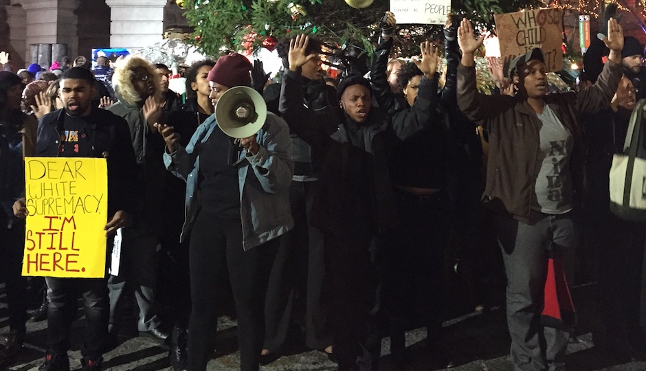 Protestors at the City Hall tree lighting ceremony on Wednesday evening. Photo | Bryan Buttler