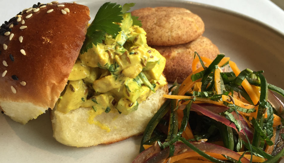 Vadouvan chicken salad sandwich on a seeded yeast roll. Served with a side of minted pickle salad with butternut squash, cucumber, and red onion with brown butter snicker doodle cookies for dessert