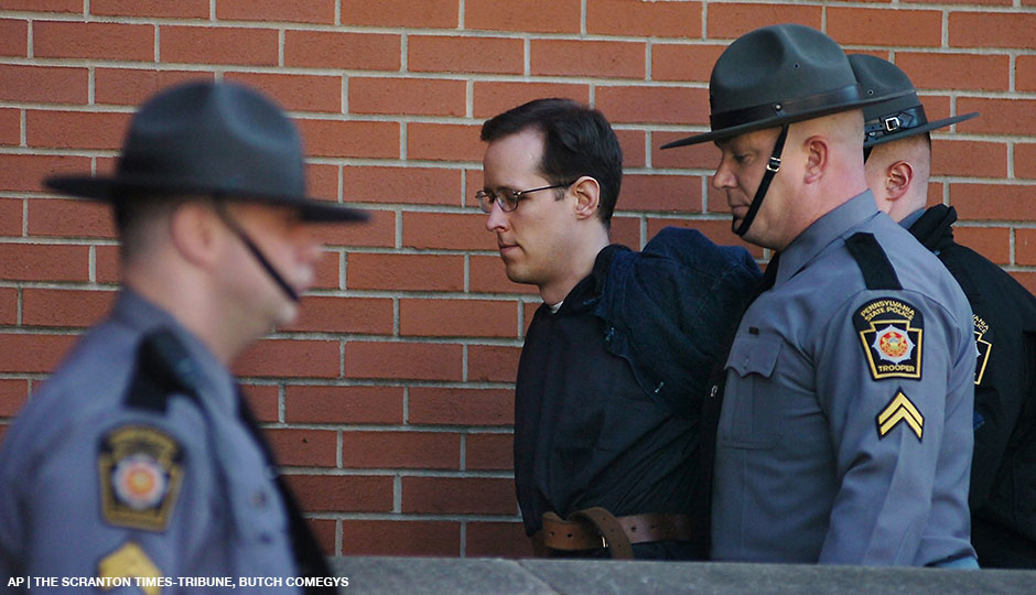 Eric Frein is led away by Pennsylvania State Police Troopers at the Pike County Courthouse after his preliminary hearing on Monday, Jan. 5, 2015 in Milford, Pa. Frein is charged with fatally shooting a Pennsylvania state trooper and wounding another during an ambush at their barracks in September. A judge ordered Frein to stand trial on the charges. Prosecutors are seeking the death penalty. Frein led authorities on a 48-day manhunt through the Pocono woods before marshals captured him at an abandoned airplane hangar.
