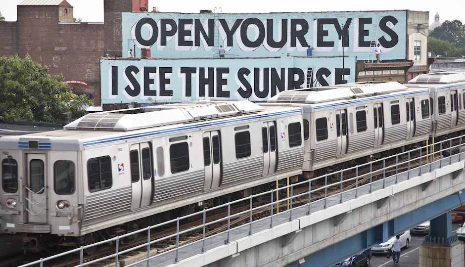 Mural Arts hosts a train ride tour of Stephen Powers Love Letter murals in West Philadelphia on TK.