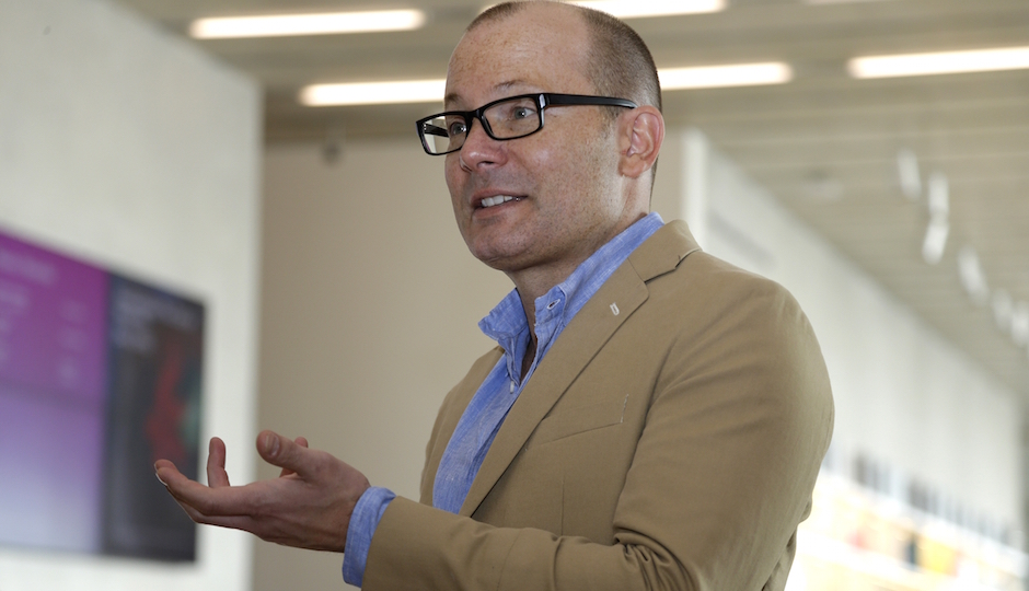In this Thursday, Dec. 12, 2013 photo, Thom Collins, director of the Perez Art Museum Miami, is shown during an interview at the museum in Miami. The museum, called the PAMM by locals, opened in December and is becoming a must-see destination for tourists and locals alike with its eclectic and provocative collection. (AP Photo/Lynne Sladky)
