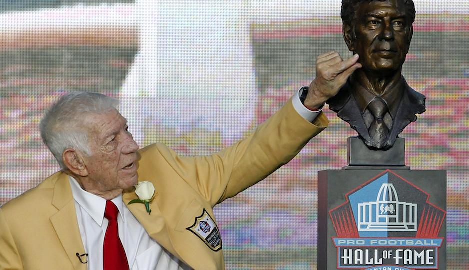 Ed Sabol touches his bust after it was unveiled during the induction ceremony at the Pro Football Hall of Fame Saturday, Aug. 6, 2011, in Canton, Ohio. (AP Photo/Ron Schwane)