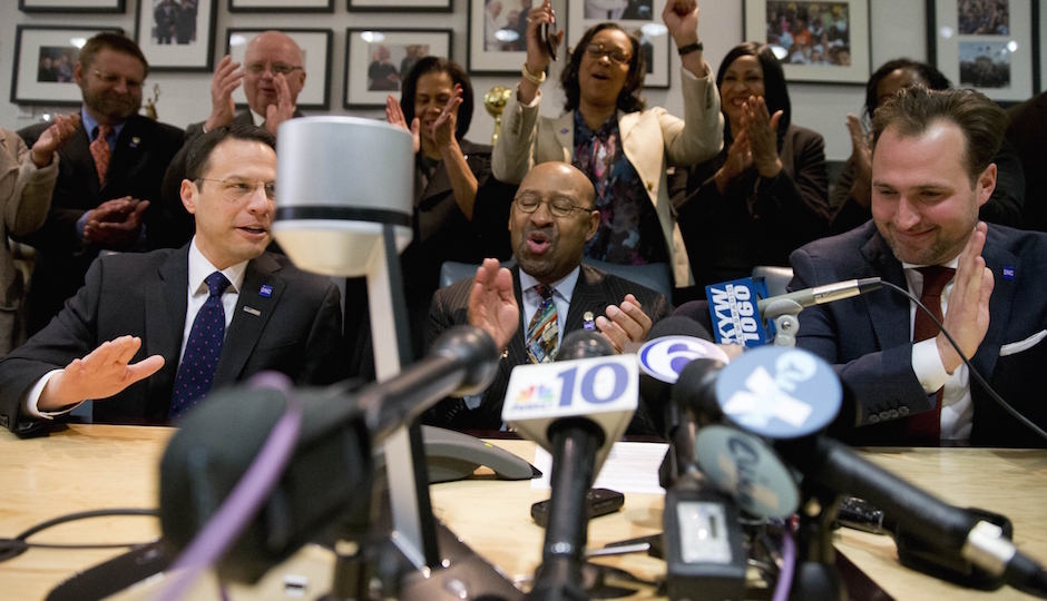 Philadelphia Mayor Michael Nutter, center, reacts during a conference call with Democratic National Committee Chair Rep. Debbie Wasserman Schultz and other officials, Thursday, Feb. 12, 2015, at City Hall in Philadelphia. Democrats have selected Philadelphia as the site of the party's 2016 national convention, choosing a patriotic backdrop for the nomination of its next presidential candidate. The convention will be held the week of July 25, 2016 (AP Photo/Matt Rourke)