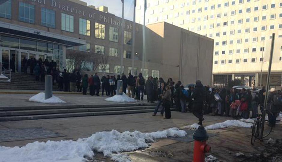 Protesters carried signs outside the Feb. 18 SRC meeting. Inside, those signs were confiscated. Photo | Holly Otterbein