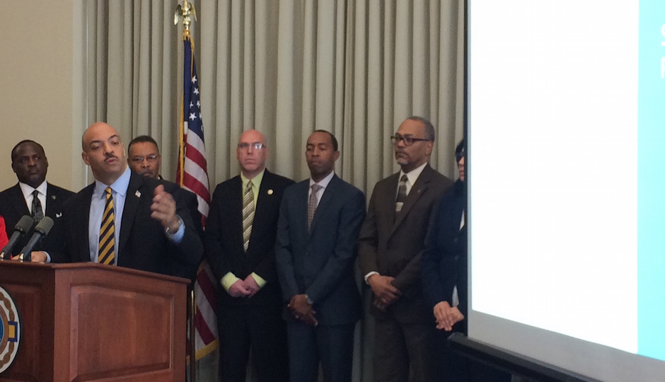 District Attorney Seth Williams, surrounded by community and clergy leaders, presents his case for not bringing charges in the Brandon Tate-Brown case.