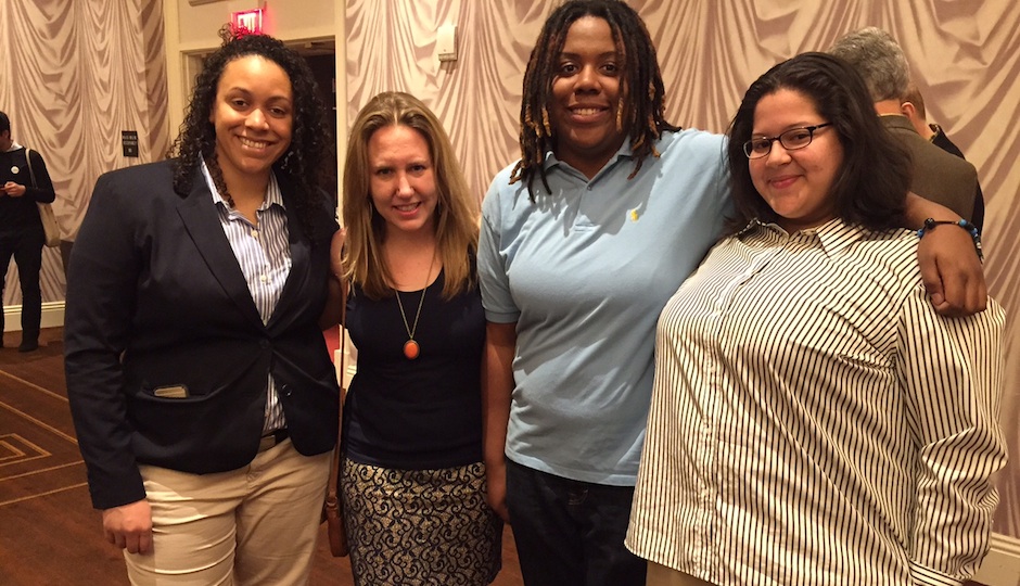 Micah Rodriguez (right) with members of the Attic Youth Center.