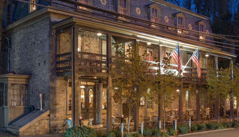 The exterior of the newly renovated inn at dusk