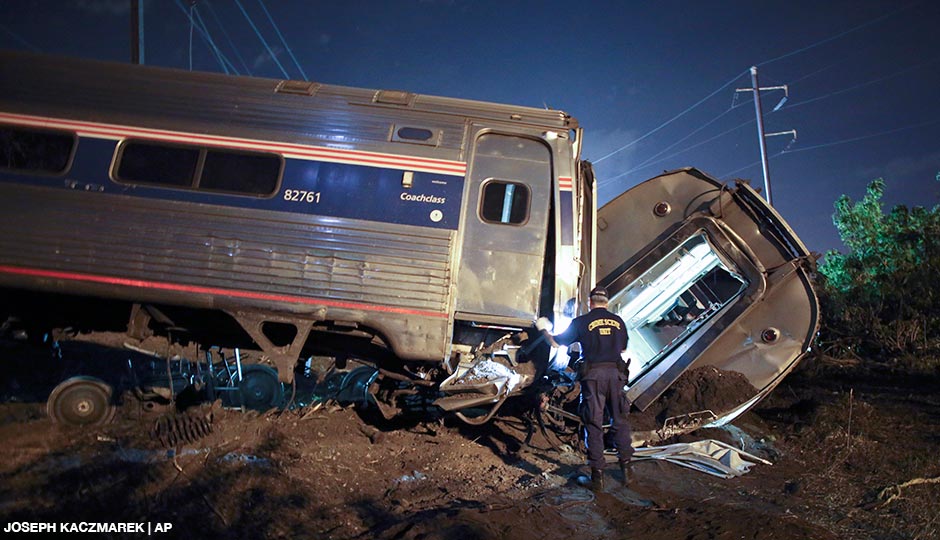 Emergency personnel work the scene of a deadly train wreck, Tuesday, May 12, 2015, in Philadelphia. An Amtrak train headed to New York City derailed and crashed in Philadelphia.