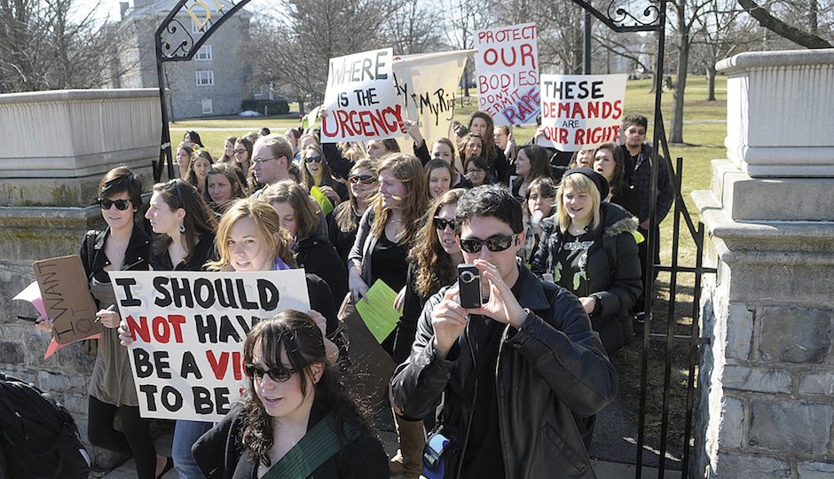 In this Wednesday, March 2, 2011 file photo, students at Dickinson College in Carlisle, Pa. march across the campus demanding the school deal more harshly with students who commit sexual offenses. (AP Photo/The Sentinel, Jason Malmont)