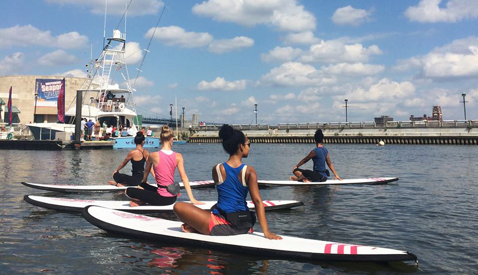 Outdoor Yoga in Philadelphia | Stand up paddleboard yoga at Spruce Street Harbor Park