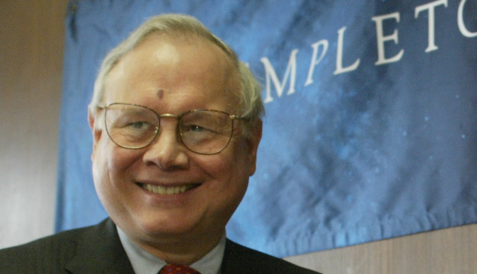 John Templeton, Jr., left, congratulates 2004 Templeton Prize winner Dr. George F. R. Ellis, a leading theoretical cosmologist and a professor of applied Mathematics at University of Cape Town, South Africa, at a news conference in New York, Wednesday, March 17, 2004.  The Templeton Prize, valued at $1.4 million, is awarded to an individual for "progress toward research or discoveries about spiritual realities." (AP Photo/Diane Bondareff)