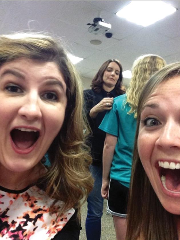 Reader Selfie: Lauren Sammartino and Robyn Cartlidge with Tina Fey (sort of) as she autographs a fan t-shirt at the Upper Darby Performing Arts Center, August 16, 2014.
