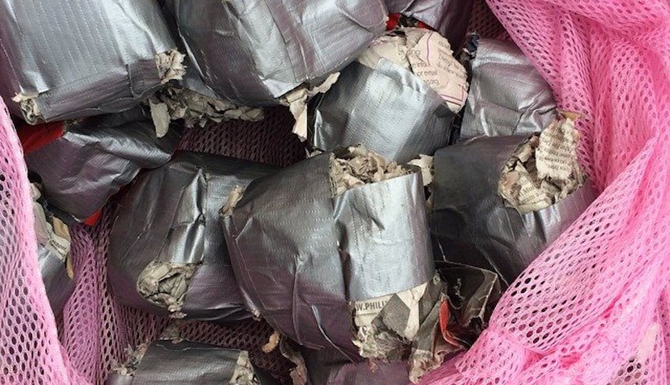 Photo of duct tape and newspaper wiffle balls by Leslie Marie Grace. For the original image, which shows more of the balls, go here.