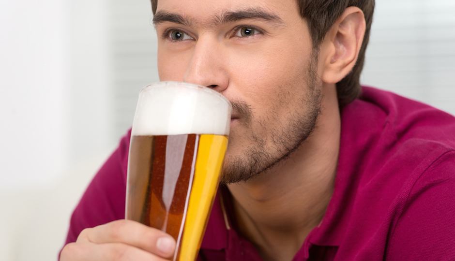 man drinking beer