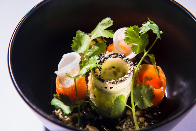This is a salad of charred cucumber, carrot, pickled daikon and cashews, dressed in jalapeño vinaigrette and sriracha honey. 
