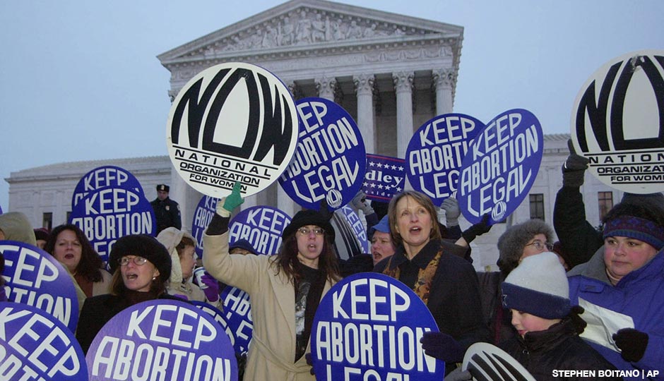 Patricia Ireland, president of National Organization for Women (NOW), third from right, demonstrates with other NOW participants in favor of the Roe vs. Wade decision during the candlelight vigil on the steps of the Supreme Court in Washington D.C. in 2000.