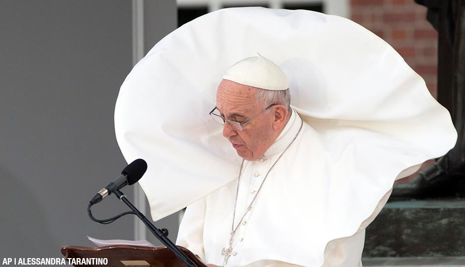 The wind lifts Pope Francis' mantle as he delivers his speech in front of Independence Hall, Saturday, Sept. 26, 2015.