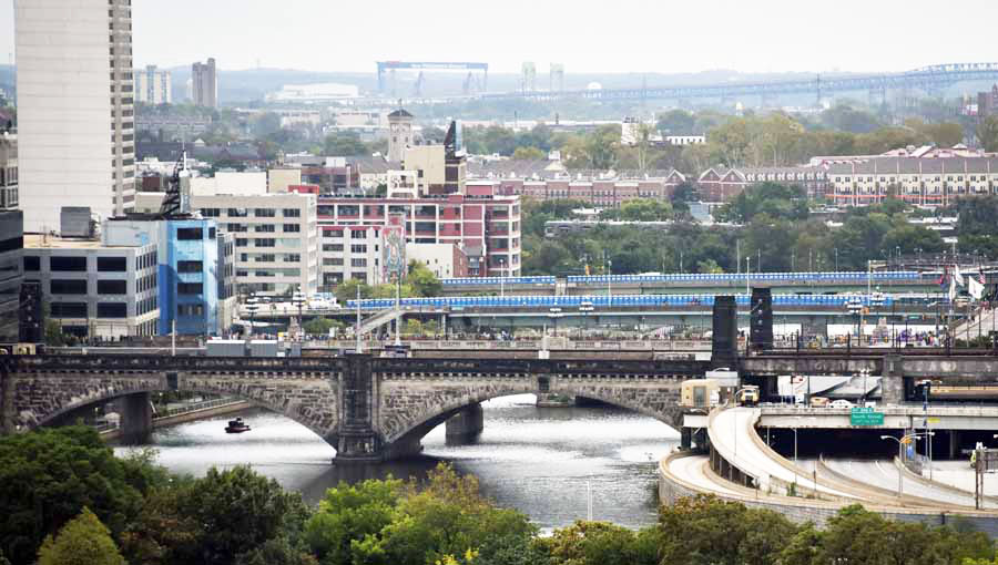 Pilgrams make their way over the Market Street Bridge, with #popeportapotties lining JFK and Walnut Street Bridges. An Empty Schuylkill Expressway, with a police boat in the Schuykill River.