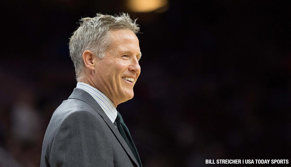 Philadelphia 76ers head coach Brett Brown smiles as time winds down in the second half of a March game against the Sacramento Kings.