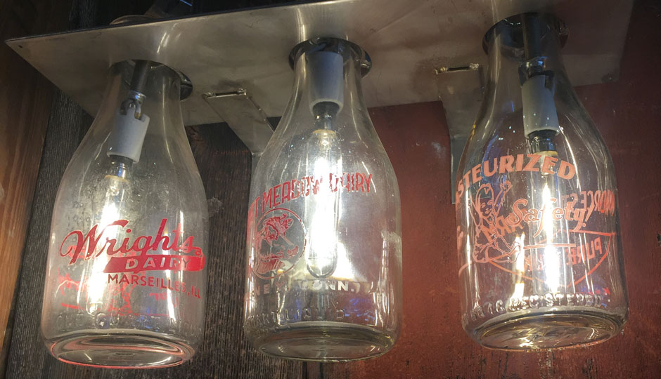 Glass milk bottles double as lighting at Meltkraft.