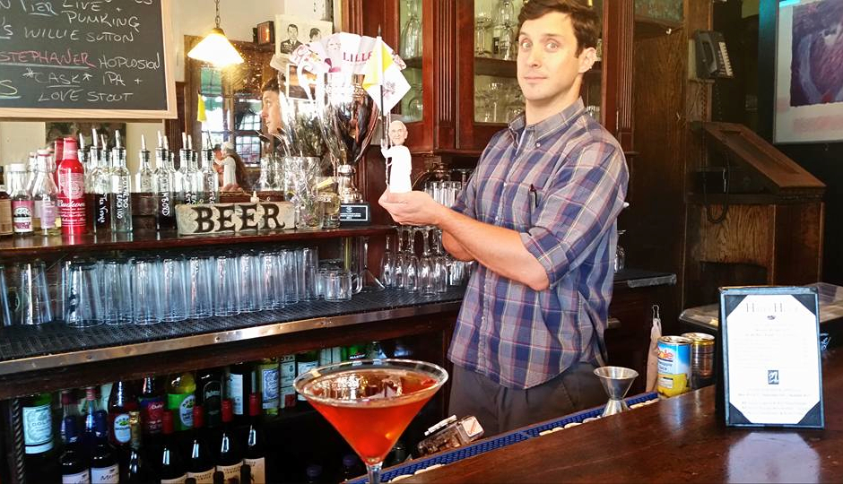 London Grill bartender Francis poses with a Pope Francis bobblehead. (Photo courtesy Jeff Belonger.)