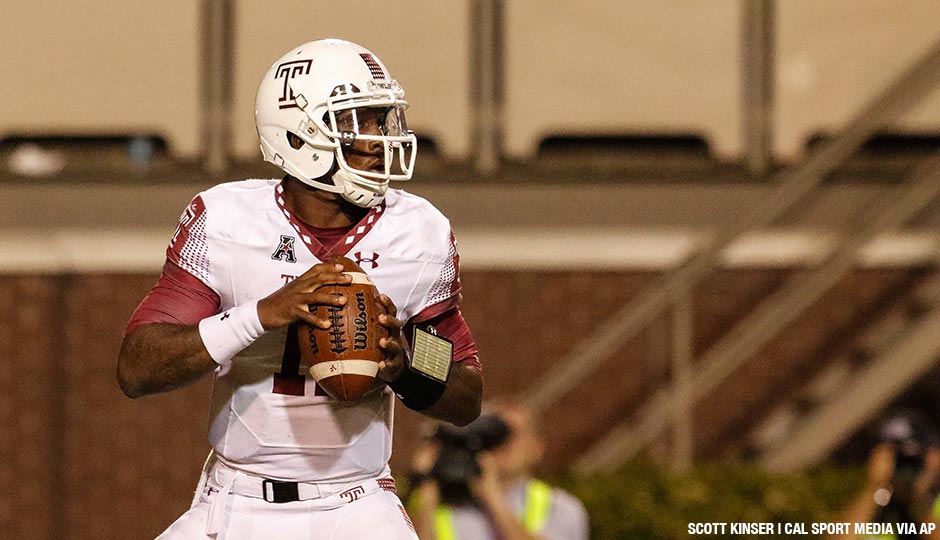 Quarterback P.J. Walker of the Temple Owls drops back to pass in the third quarter of the NCAA football matchup between the Temple Owls and the East Carolina Pirates at Dowdy Ficklen Stadium in Greenville, NC, on October 22, 2015.