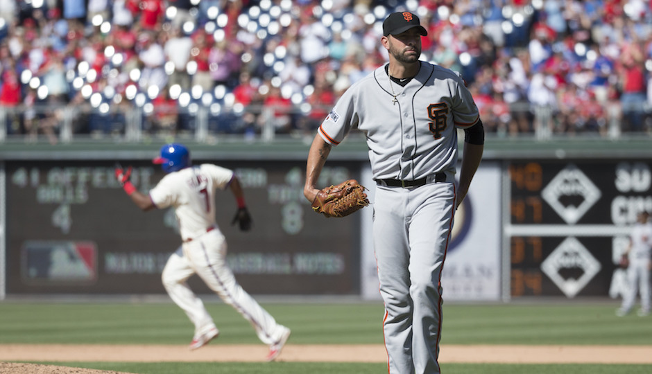 San Francisco Giants relief pitcher Jeremy Affeldt, right, looks for a new ball as Philadelphia Phillies' Maikel Franco, left, rounds the bases after hitting a solo home run during the eighth inning of a baseball game, Sunday, June 7, 2015, in Philadelphia. The Phillies won 6-4. (AP Photo/Chris Szagola)