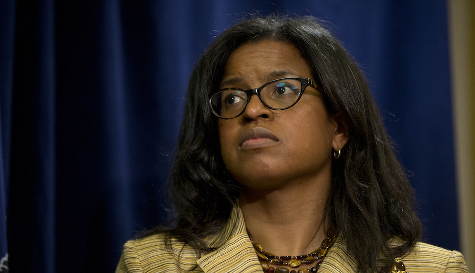 Farah Jimenez listens during a news conference Wednesday, Aug. 6, 2014, in Philadelphia. Gov. Tom Corbett said Wednesday he will authorize $265 million in advance payments to the Philadelphia school district to allow schools to open "on day one" and help avoid layoffs. He said the money represents early disbursement of funds that the schools would normally receive through the academic year. (AP Photo/Matt Rourke)