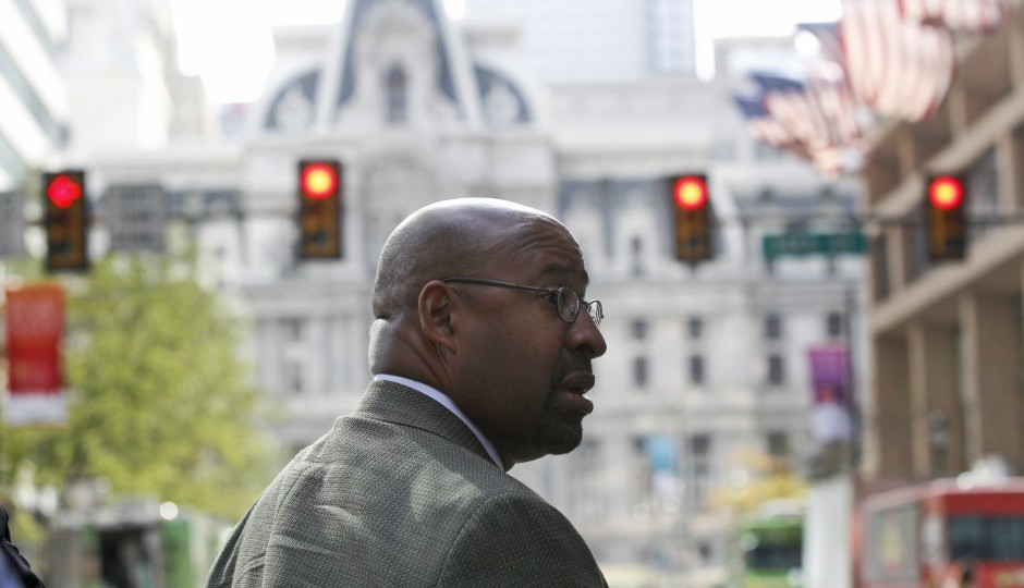 Philadelphia Mayor Michael Nutter walks down a blocked off Market Street, with City Hall in the background, in Philadelphia on Friday, Sept. 25, 2015, before Pope Francis' trip. (AP Photo/Mel Evans)