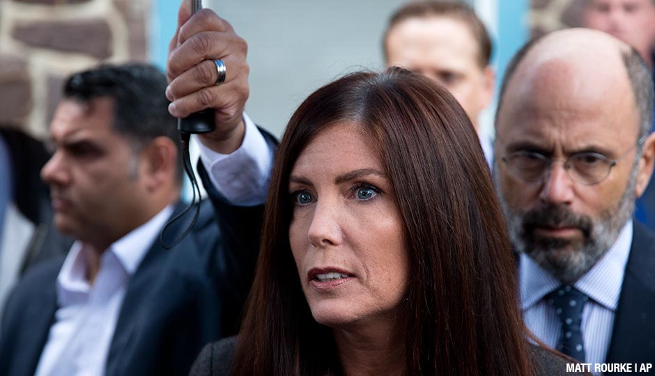 Pennsylvania Attorney General Kathleen Kane speaks with members of the media after her arrangement before a district judge, Thursday, Oct. 1, 2015, in Collegeville, Pa. Prosecutors added a new perjury count and other criminal charges Thursday against Kane, saying they found a signed document that contradicts her claims she never agreed to maintain secrecy of a grand jury investigation in 2009, before she took office. The Montgomery County district attorney charged her with felony perjury and two misdemeanors — false swearing and obstruction — based on a signed secrecy oath she signed shortly after taking office in early 2013.