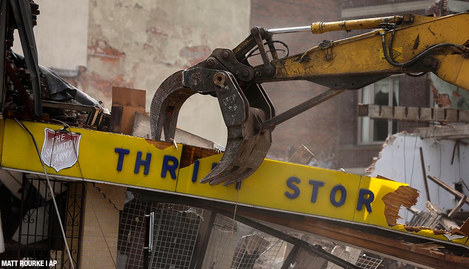 A Salvation Army Thrift store is demolished in the aftermath of a building collapse, Thursday, June 6, 2013, in Philadelphia. On Wednesday, the building under demolition collapsed onto a neighboring thrift store, killing six people and injuring 14, including one who was pulled from the debris nearly 13 hours later.