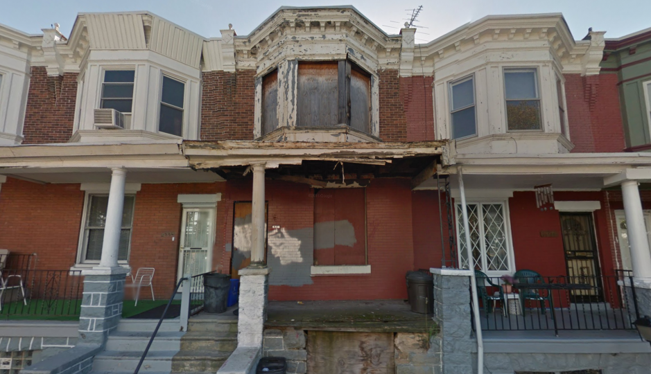 A blighted, vacant home lacking doors and windows on an otherwise healthy block in West Philadelphia. | Image: Google Streetview.