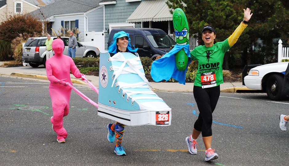 Runner Andi Sawin, pictured here as the sneaker, and her friend, Carolyn Stellatella, the bubble gum and also creator of both costumes in full.