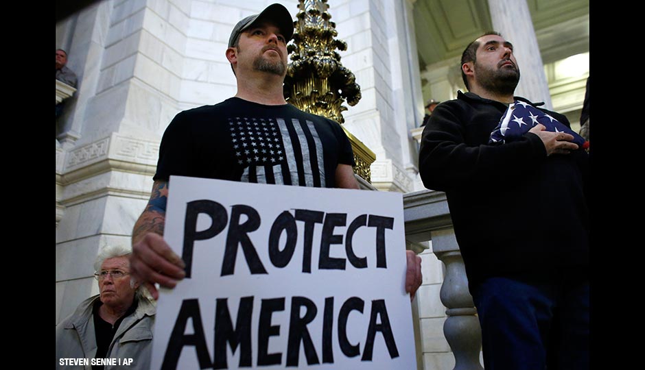 Veterans during a rally Thursday, Nov. 19, 2015, at the Statehouse, in Providence, R.I., held to demonstrate against allowing Syrian refugees to enter Rhode Island following the terror attacks in Paris.