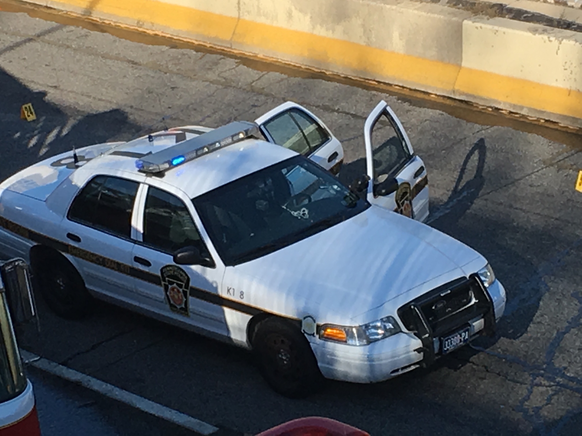 Bullet holes in trooper car's windshield.
