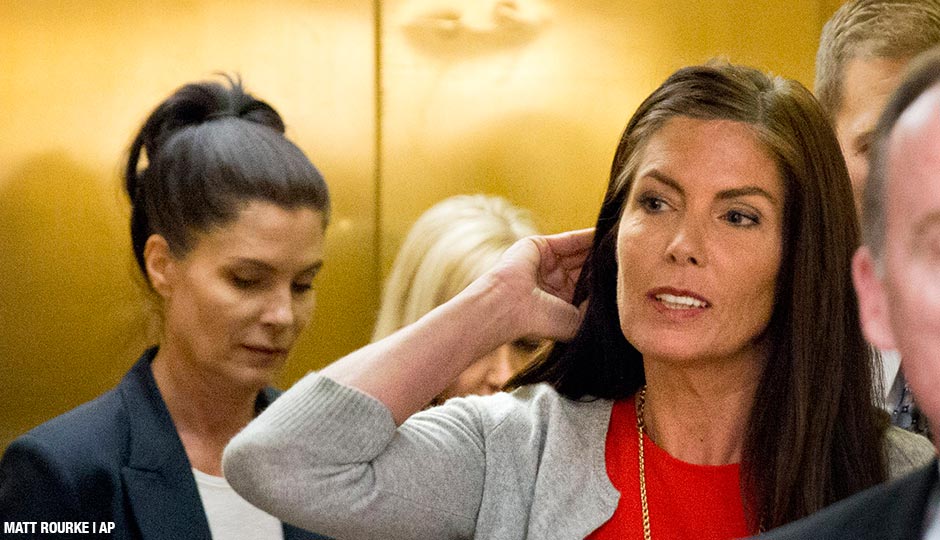Pennsylvania Attorney General Kathleen Kane, center, accompanied by with her twin sister, Ellen Granahan, left, departs after her preliminary hearing Monday, Aug. 24, 2015, at the Montgomery County courthouse in Norristown, Pa. Kane is accused of leaking secret grand jury information to the press, lying under oath and ordering aides to illegally snoop through computer files to keep tabs on an investigation into the leak.