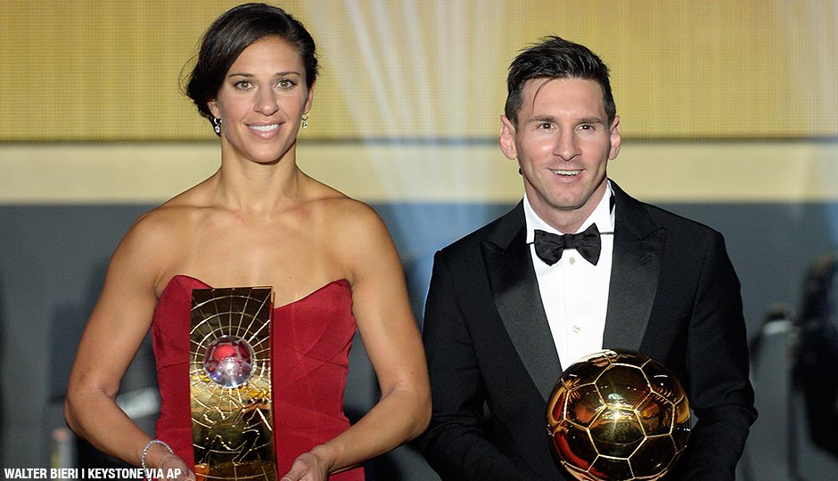 Carli Lloyd of the USA and Argentina's Lionel Messi pose with their trophies after winning the FIFA soccer player of the year 2015 prize during the FIFA Ballon d'Or awarding ceremony at the Kongresshaus in Zurich, Switzerland, Monday, January 11, 2016.